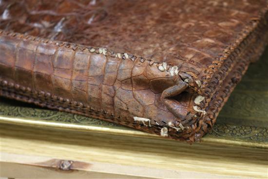 An early 20th century crocodile skin briefcase and a suitcase length 49cm